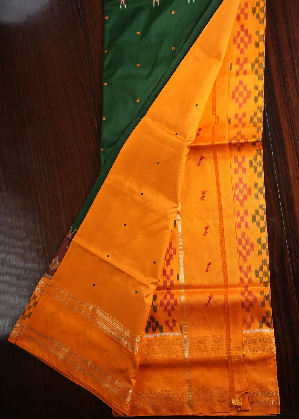 Dark Green Ikkat Silk Saree with Orange Accents
