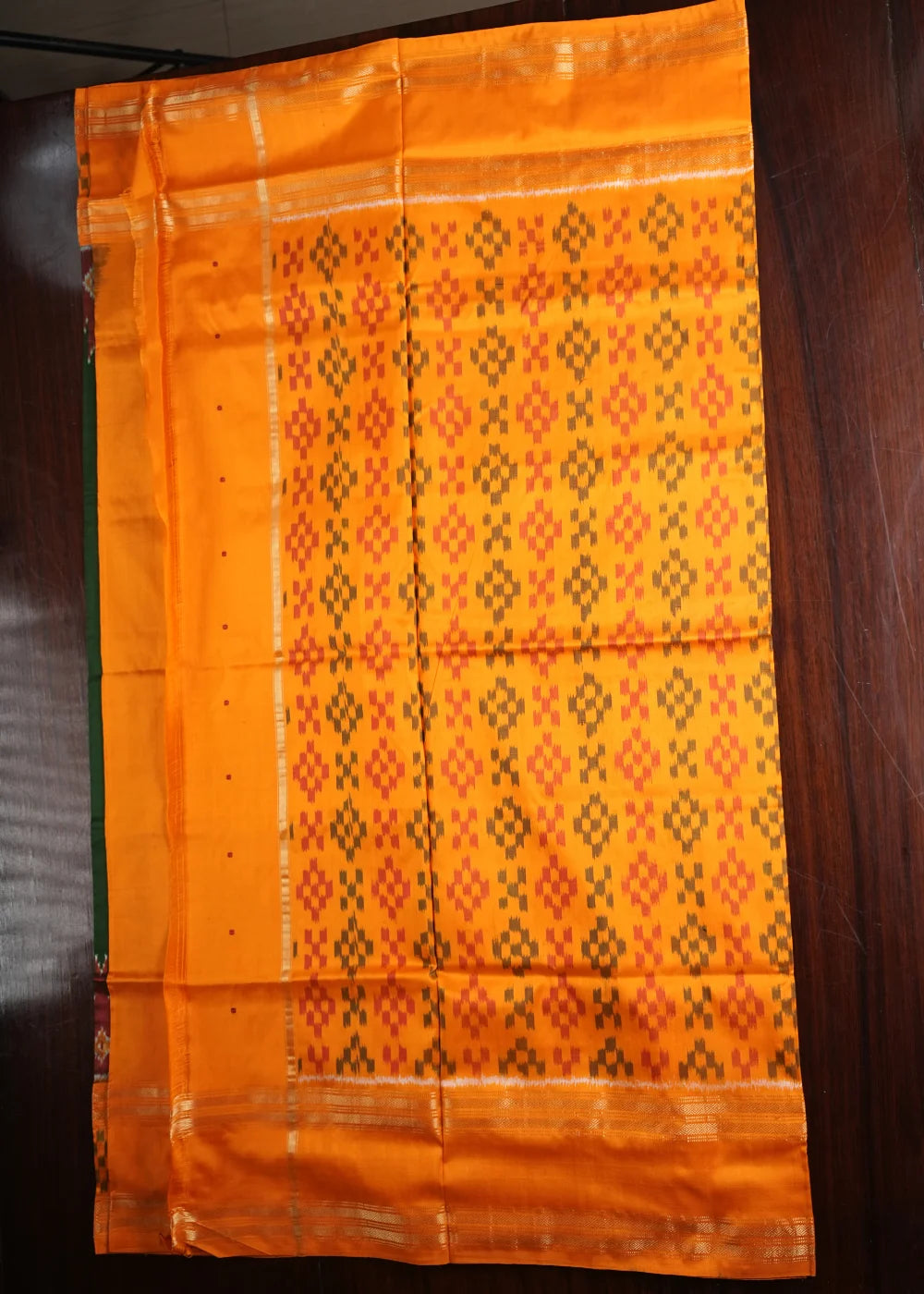 Dark Green Ikkat Silk Saree with Orange Accents