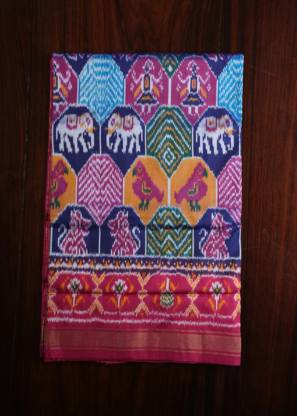 Magenta Ikkat Silk Saree with Multicolor Patterns