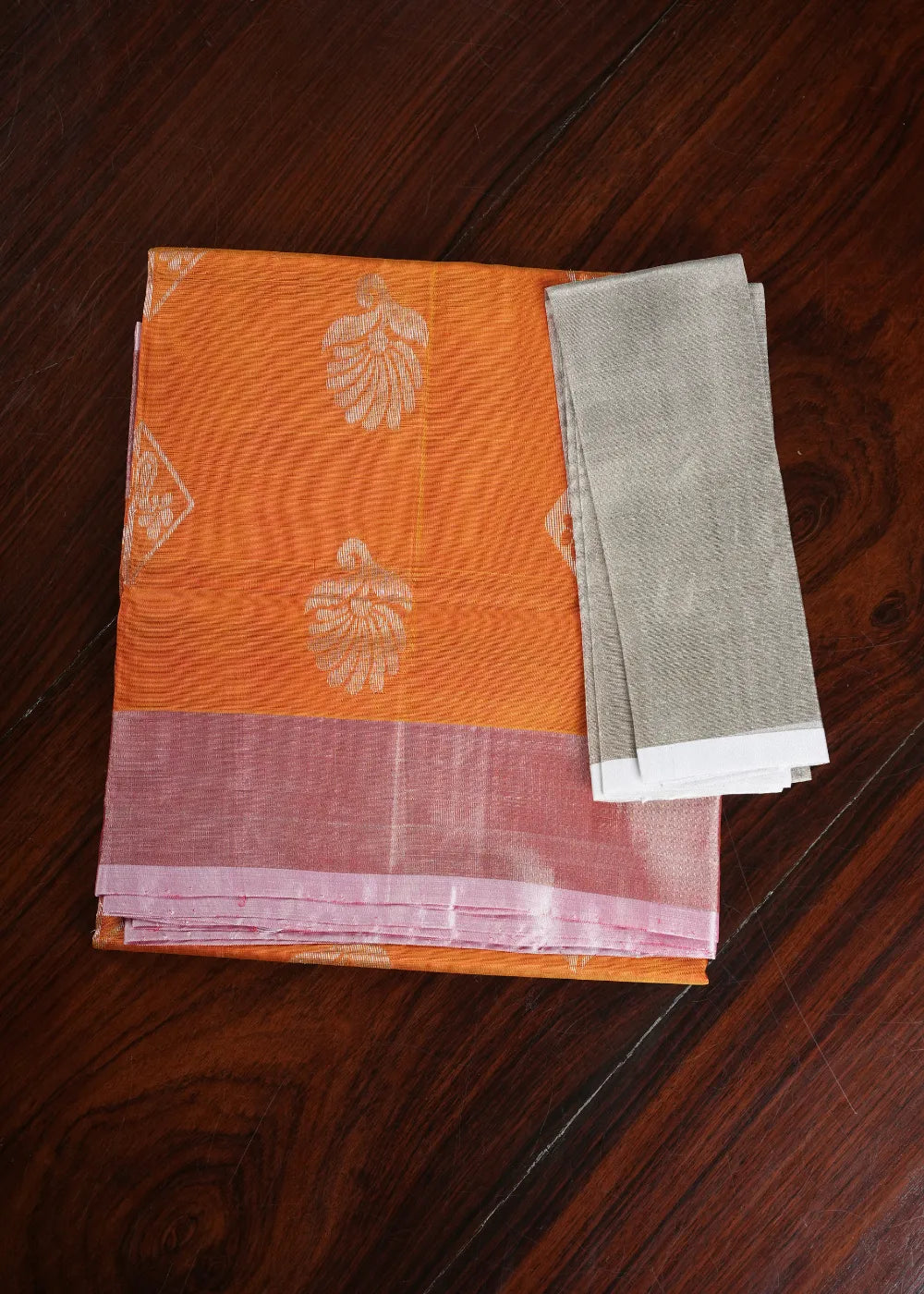 Orange Uppada Silk Saree with Silver Bhutta and Khaddi Border