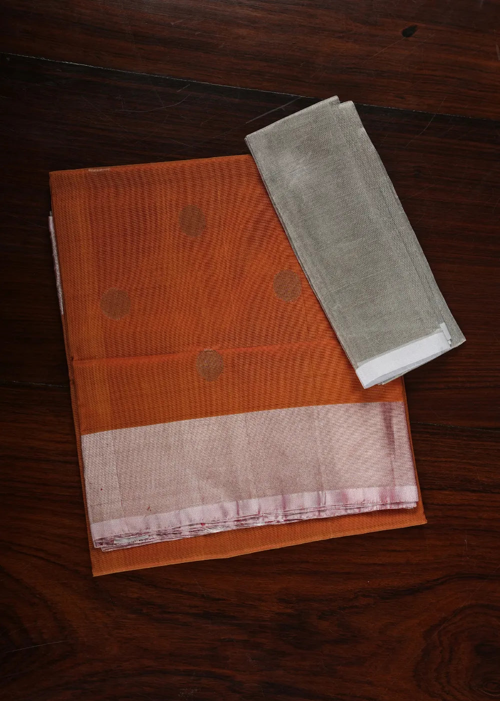 Rust Uppada Silk Saree with Dollar Bhutta and Silver Border