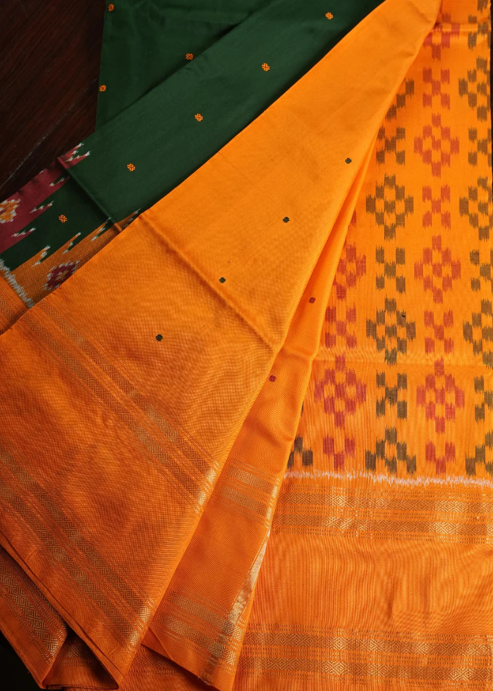 Dark Green Ikkat Silk Saree with Orange Accents